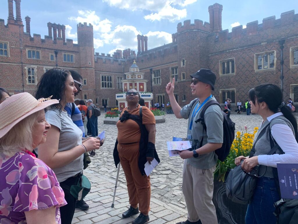 A group explore Hampton Court Palace