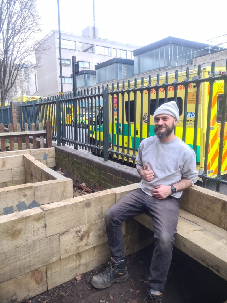 A photo of a smiling gardener