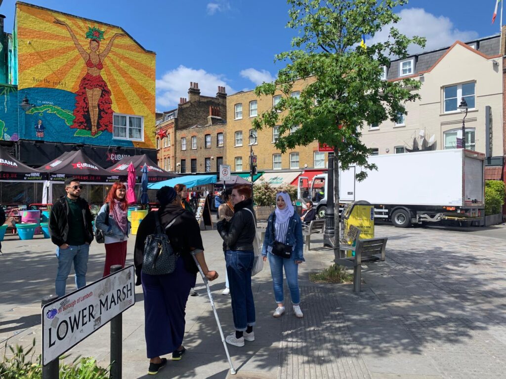 Group of people on a walking tour, Lower Marsh, Waterloo