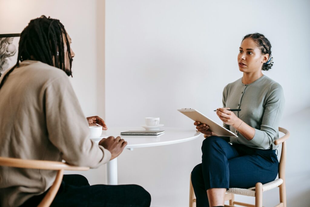 A stock image of a woman interviewing a man